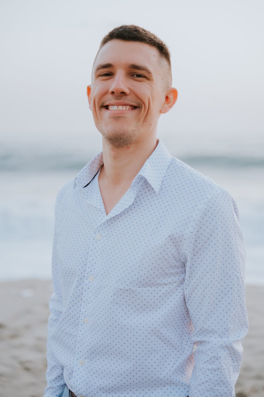 Sam Zakharia standing beside the ocean